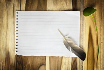 Antique notebook  quill and inkwell on wood