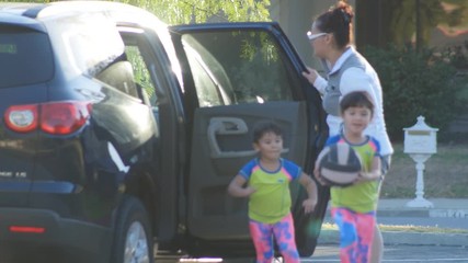 4K Mom Drops Kids Off at Soccer Practice. - Powered by Adobe