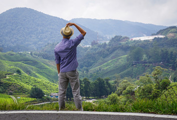 A man looking at mountain scenery