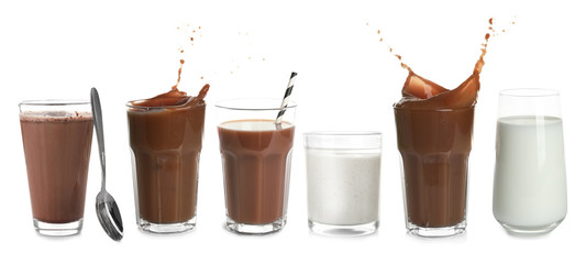 Glasses with different protein shakes on white background