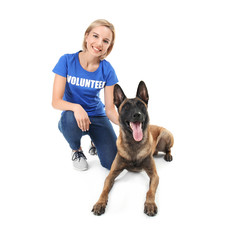Young female volunteer with dog, isolated on white. Concept of volunteering and animal shelters