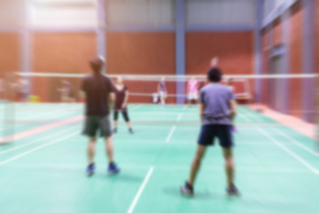Badminton court with blurred background woman playing badminton