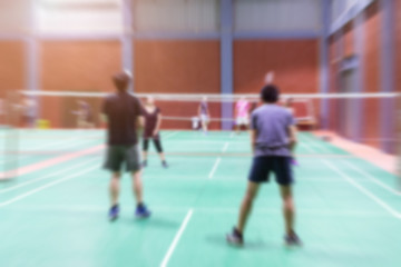 Badminton court with blurred background woman playing badminton