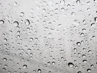 Rain water Drops On gray Background.