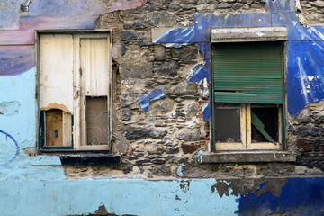 FUNCHAL, MADEIRA, PORTUGAL - SEPTEMBER 7, 2017: Ruinous facades painted in the streets of the historic center of the city