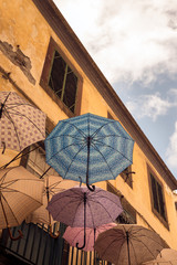 Fototapeta na wymiar FUNCHAL, MADEIRA, PORTUGAL - SEPTEMBER 10, 2017: umbrella on a street in the historic city center