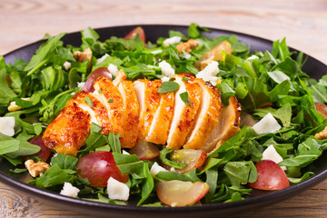 Chicken, grape, arugula, cheese and walnuts salad, horizontal
