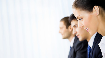 Three businesspeople working at office, with copyspace