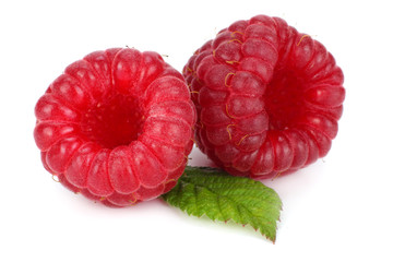 ripe raspberries with green leaf isolated on white background macro