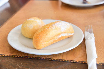 Close-Up View of French Baguette and Bread Roll