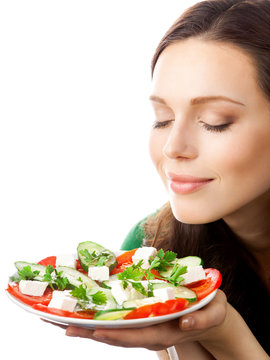 Portrait of happy smiling woman with plate of salad, isolated on white background