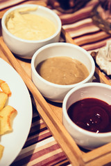 French fries with sauces on home table