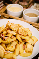 French fries with sauces on home table