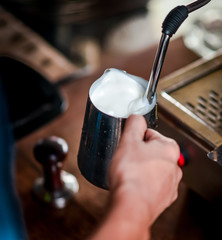 Coffee maker steam the milk for make latte art