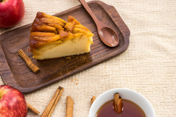 homemade apple cake with cinnamon and apple juice, autumn dessert concept