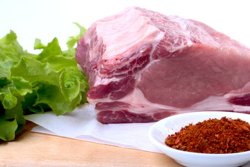 Raw pork chops with herbs and spices on cutting board. Ready for cooking.