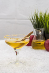 cold apple juice and cinnamon in glass