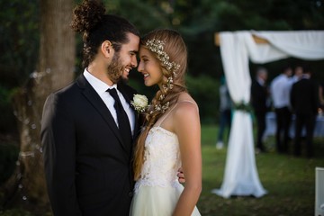 Bride and groom looking at each other
