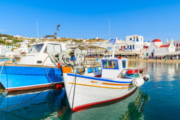 Fototapeta na wymiar Typical colourful Greek fishing boats in Mykonos town port on island of Mykonos, Cyclades, Greece