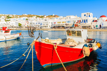 Red colour Greek fishing boat in Mykonos town port on island of Mykonos, Cyclades, Greece © pkazmierczak