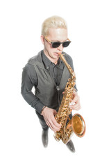 Fototapeta premium Elegant blond man dressed in black, playing the saxophone. Isolated