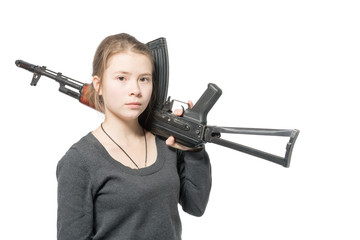 A girl in a gray sweater with a Kalashnikov in his hands. Isolated