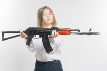 Girl with a Kalashnikov in his hand. Isolated