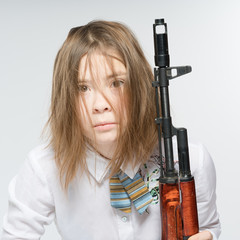 Girl with a Kalashnikov in his hand. Isolated