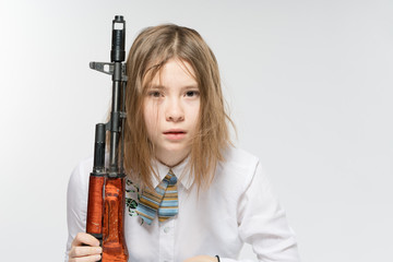 Girl with a Kalashnikov in his hand. Isolated