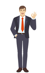 Businessman with hand in pocket showing a okay hand sign.
