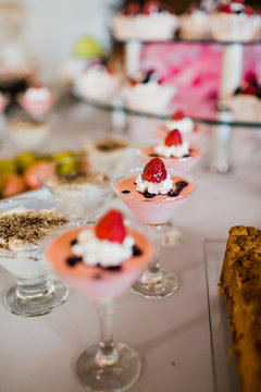 Martini glasses with cream and strawberries