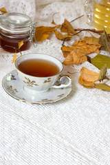 tea, cinnamon, apples, honey and star anise on a white background