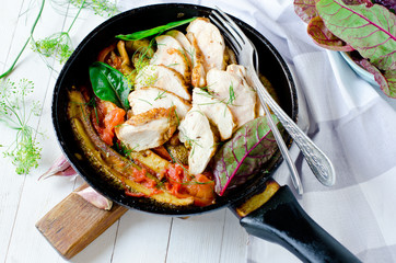 Chicken breast with stewed zucchini and tomatoes