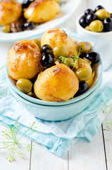 Whole stewed potatoes with onions and olives