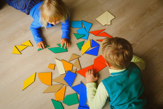 kids playing with puzzle, education concept
