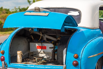 Trunk of the retro car, Vinales, Pinar del Rio, Cuba. Car repairs. Close-up.