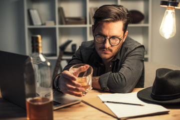 Fototapeta premium unsuccessful musician drinking alone