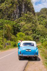 American retro car on the road, Vinales, Pinar del Rio, Cuba. Copy space for text.