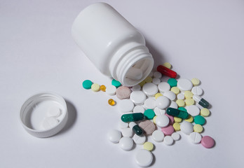 Various medications and vitamins, a pill bottle. Pastel background, place to insert your text. Health and pharmacy.