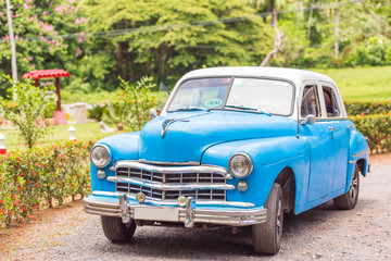 American retro car on the road, Vinales, Pinar del Rio, Cuba. Copy space for text.