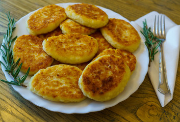 pancakes made of cottage cheese, made at home, on a plate.