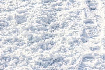 White texture, snow backgrounds with footprints on path