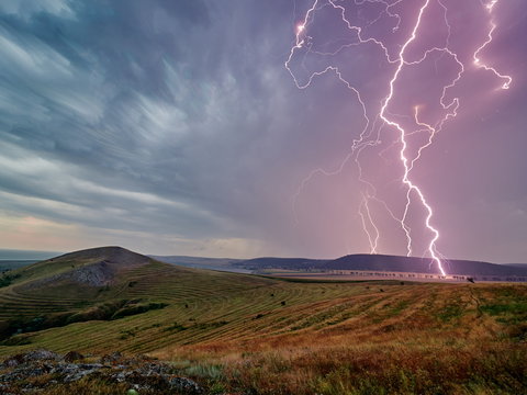 Thunderstorm with lightnings over the fields