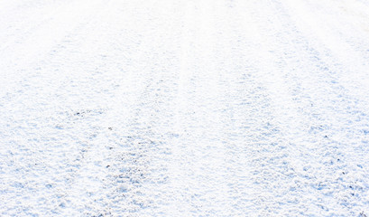 White road in winter, texture of snow, background
