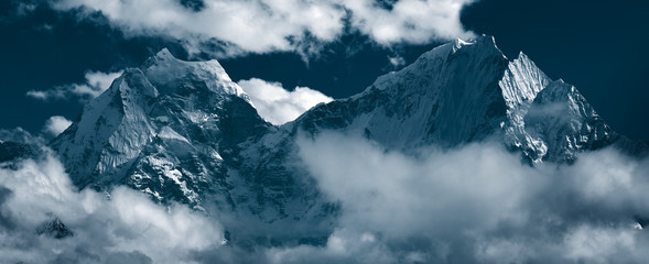 Panoramic view of mountain peaks Kangtega, also known as "The Snow Saddle" (6,782 m.) and Thamserku (6,608 m.). Himalayas, Khumbu, Eastern Nepal
