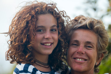 Fototapeta premium A mother with her daughter in a very affectionate and happy attitude...