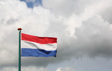 Dutch flag waving with cloudy sky background