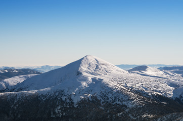 Fototapeta na wymiar Winter panorama of the Montenegrin Range (Chornagora) in the Carpathians; The highest ridge in Ukraine.