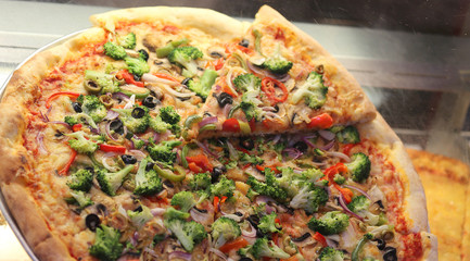 stuffed pizza with tomato mozzarella and broccoli