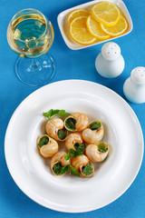 portion of Snails with herbs, butter